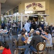 Many people sit outside eating at Pho Ha Noi in San Jose