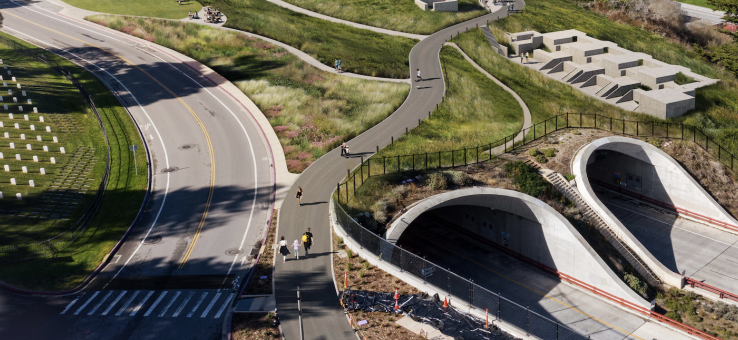 Computer generated overhead rendering of Battery Bluff. Includes blue, cloudy skies, greenery surrounding the park and streets, the Golden Gate Bridge, and the Bay.